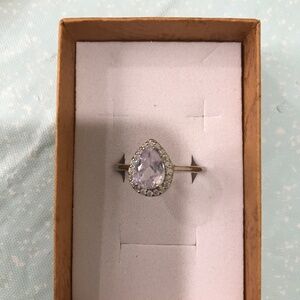 Silver tone pear stone ring with halo